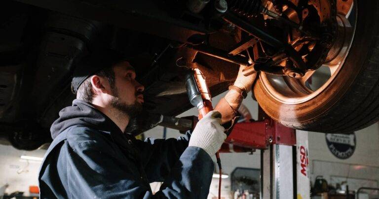 mechanic-inspecting-car