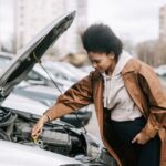 african-woman-fixing-a-car-engine