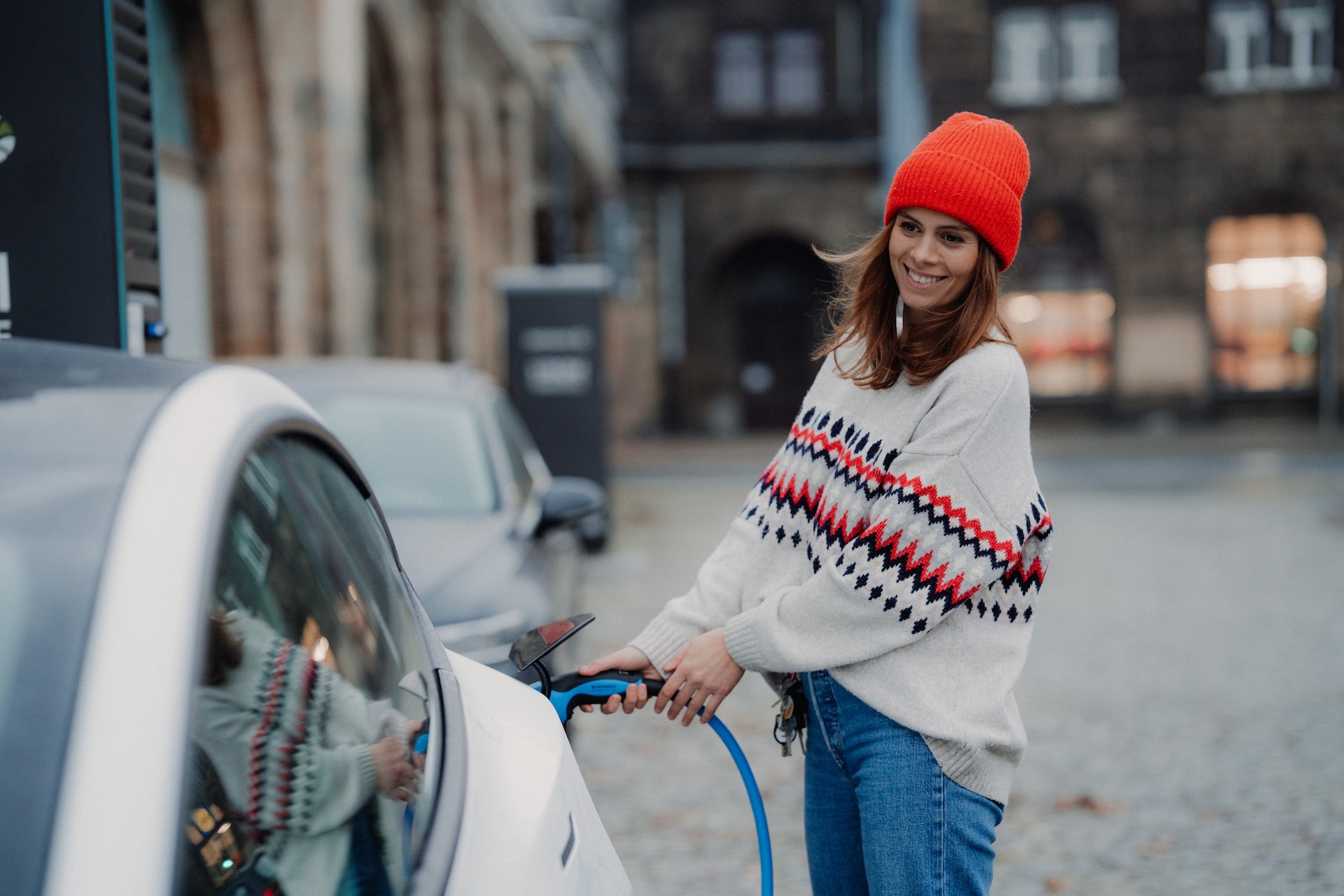 woman-charging-electric-car